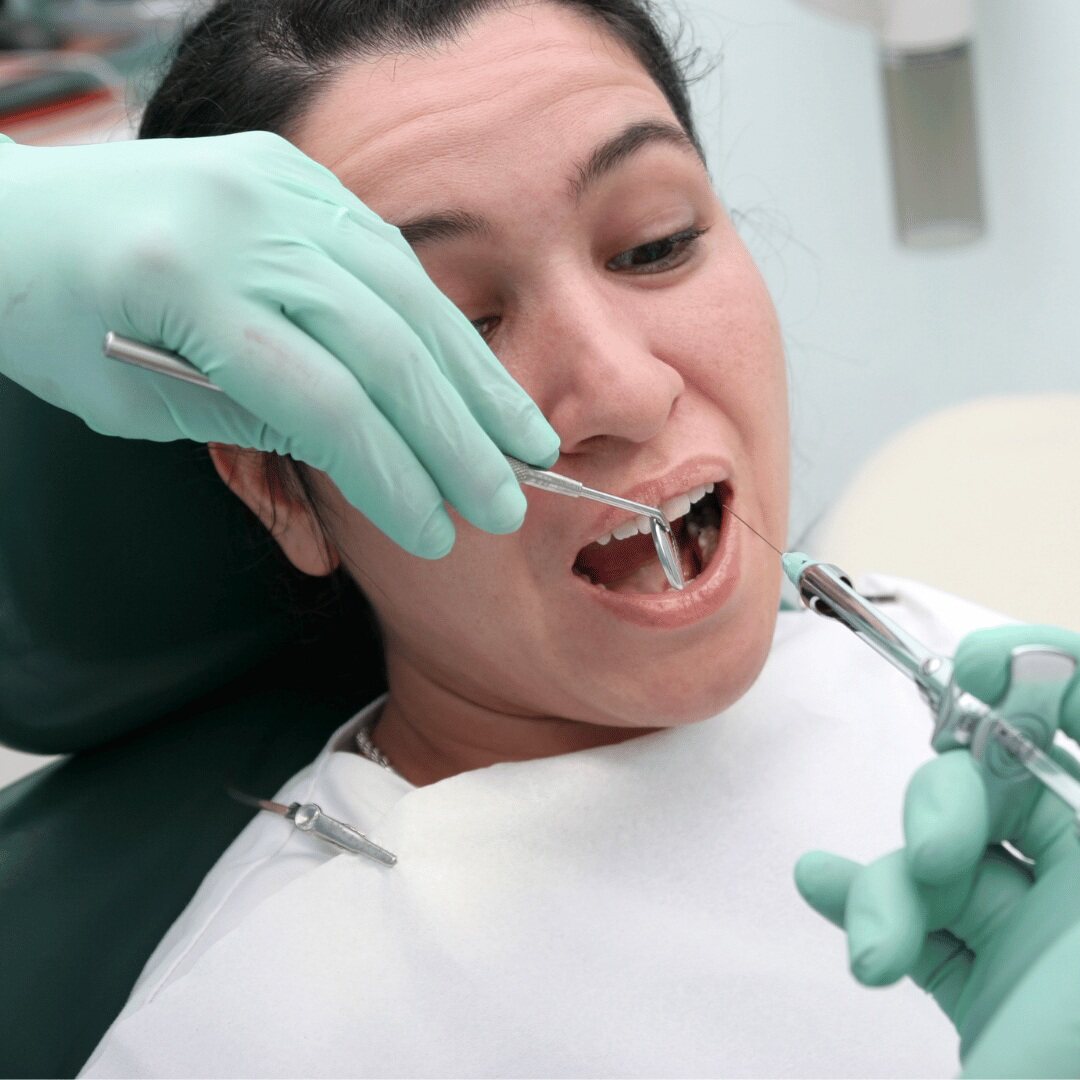 A nervous patient in the dental chair during treatment