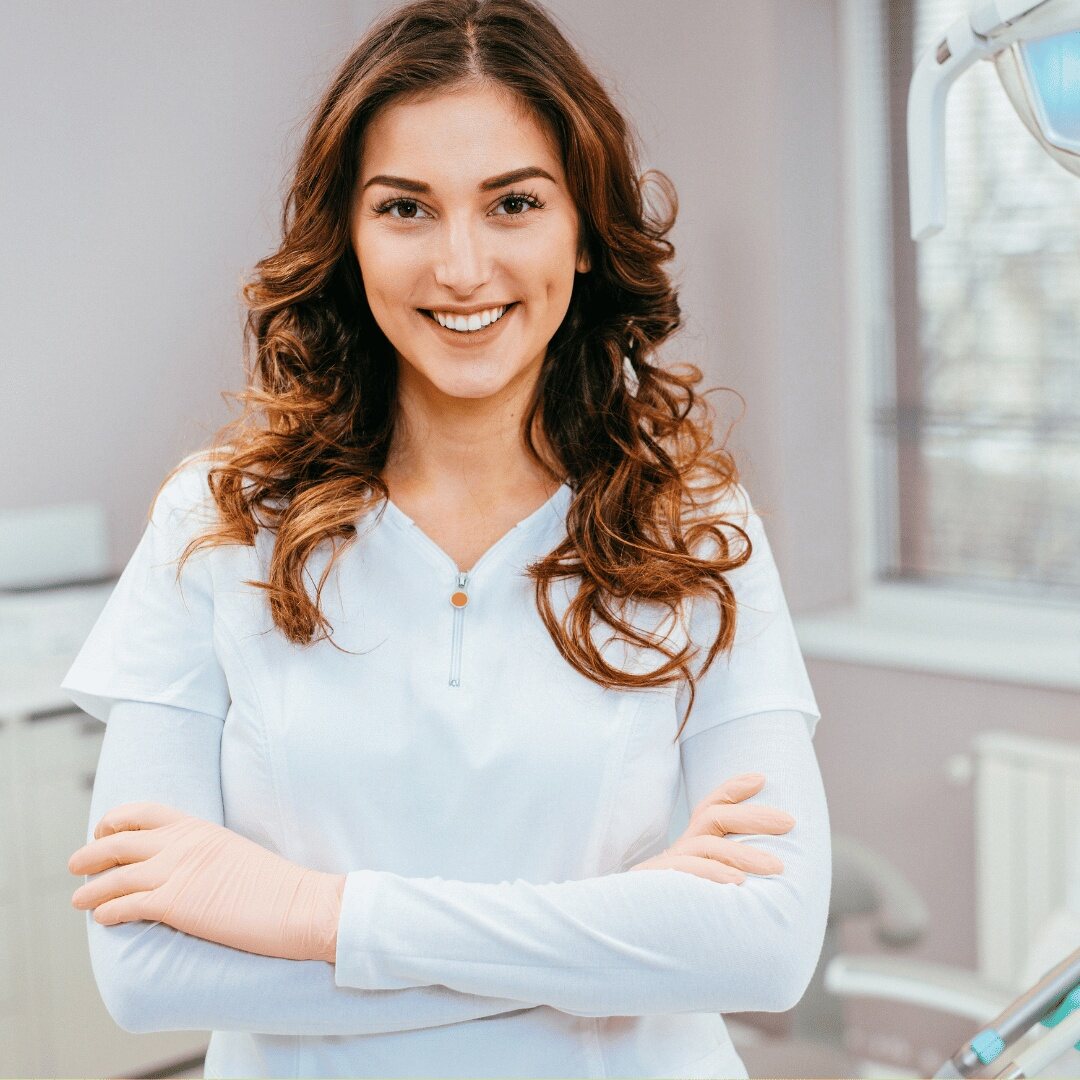 A patient standing in the clinic after her extraction appointment