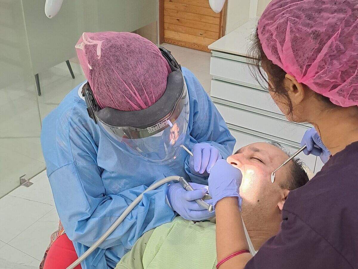 Treatment being carried out under magnification with an assistant